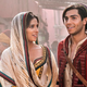 Naomi Scott as Princess Jasmine and Mena Massoud as Aladdin.